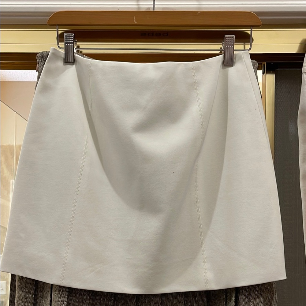 Elegant Bebe White Miniskirt